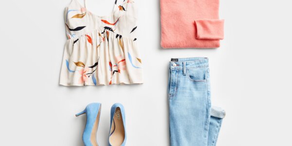 Stitch Fix Women’s date night at home featuring blue jeans, white patterned tank, peach sweater and light blue heels.