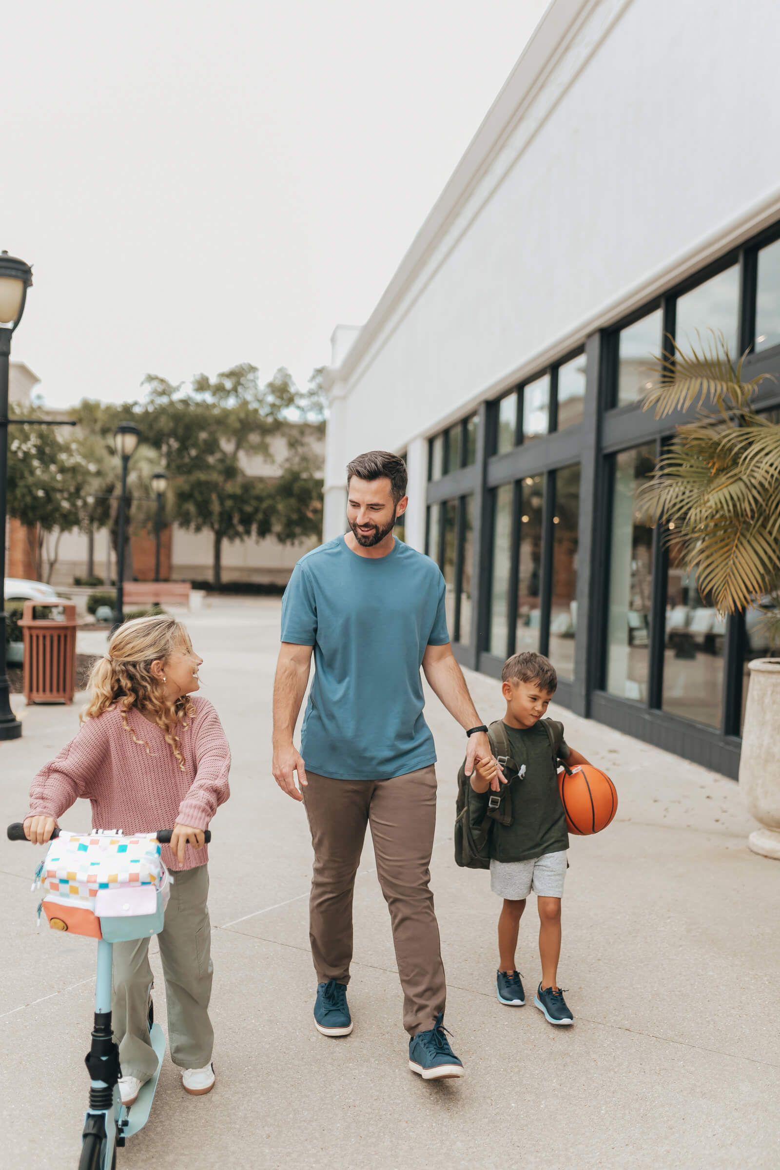 dad in fall outfit with kids